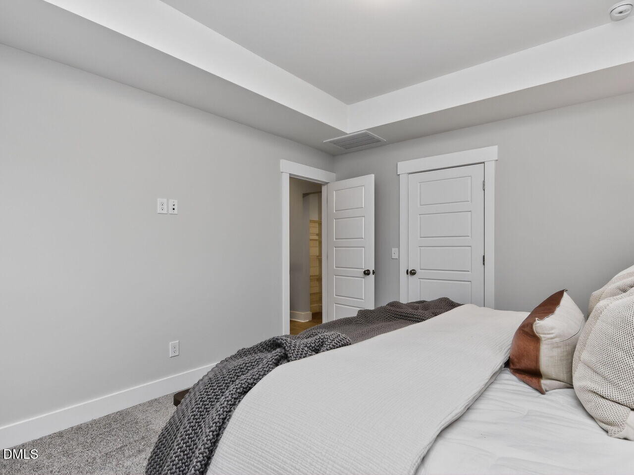 13 Tallgrass Road Pittsboro, NC 27312 - Photo 16 of 34 a bedroom with a bed and closet