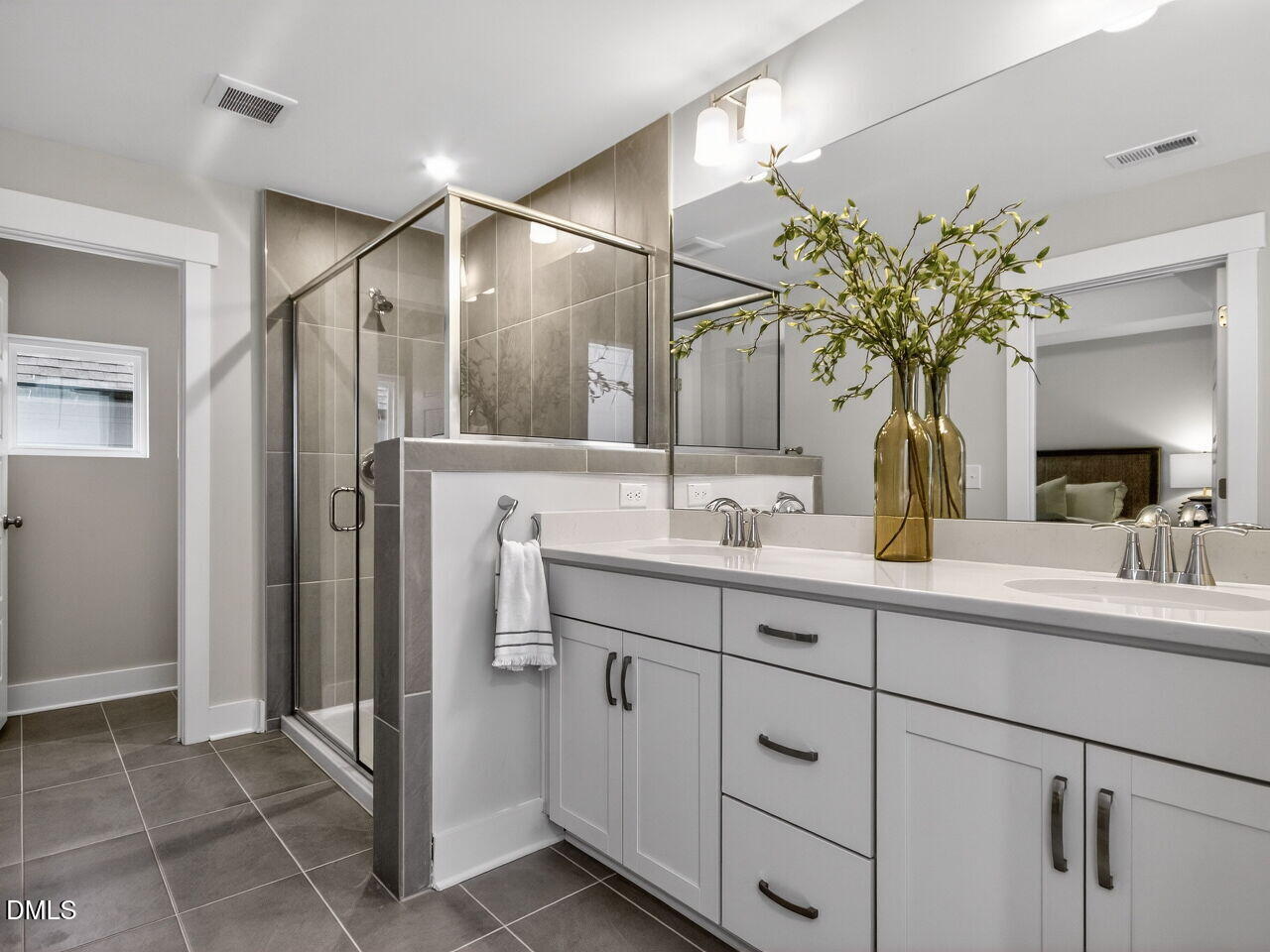 13 Tallgrass Road Pittsboro, NC 27312 - Photo 17 of 34 a bathroom with a double vanity sink and a mirror