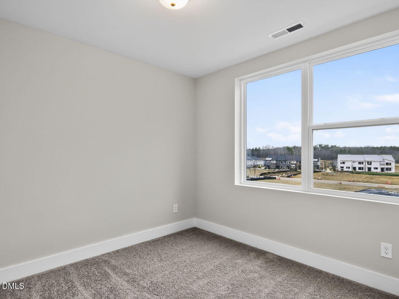13 Tallgrass Road Pittsboro, NC 27312 - Photo 21 of 34 an empty room with a window