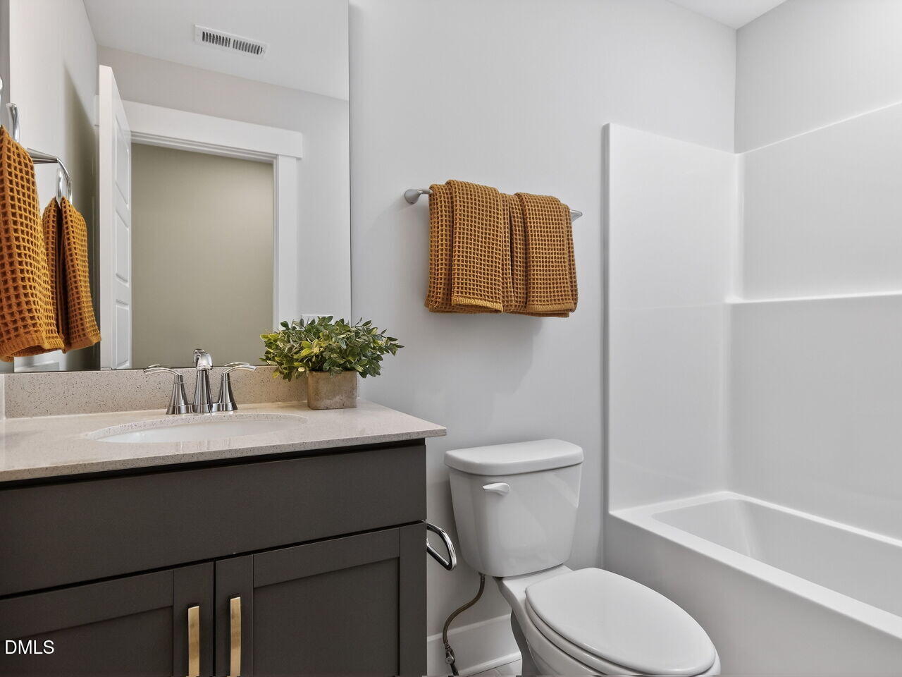 13 Tallgrass Road Pittsboro, NC 27312 - Photo 22 of 34 a bathroom with a sink toilet and shower