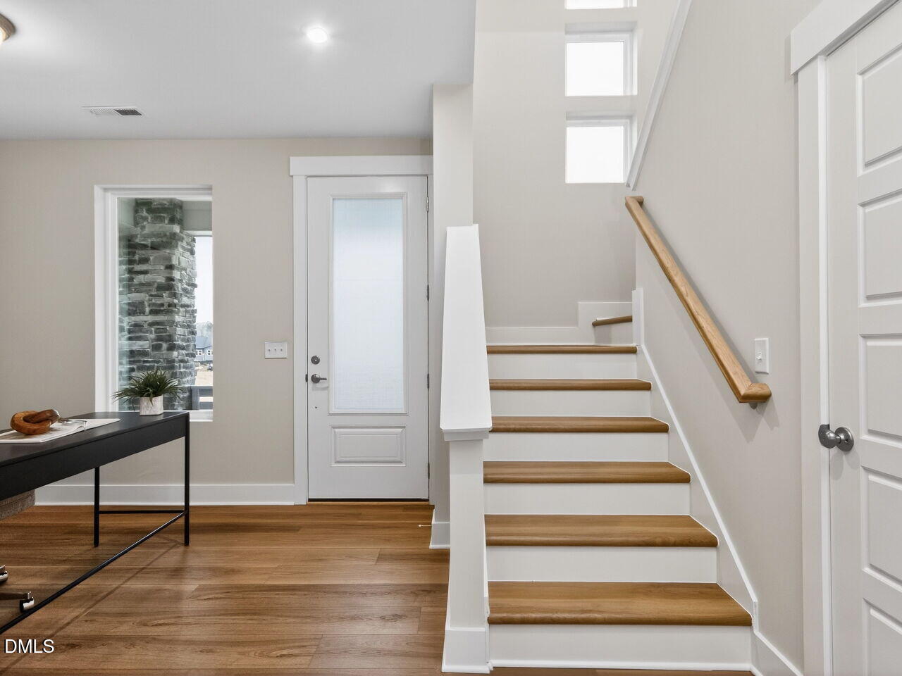 13 Tallgrass Road Pittsboro, NC 27312 - Photo 3 of 34 a view of entryway with wooden floor and stairs