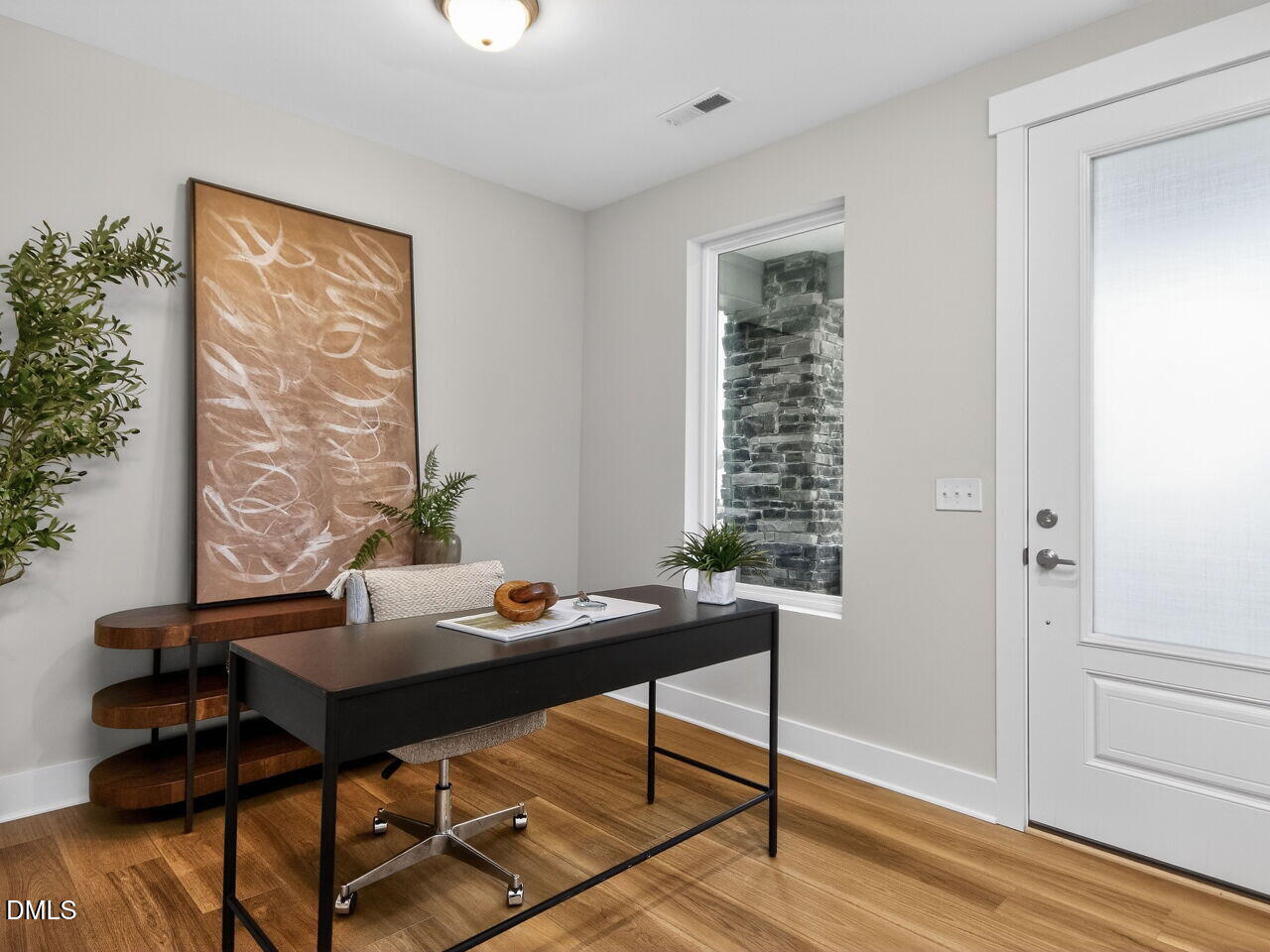 13 Tallgrass Road Pittsboro, NC 27312 - Photo 4 of 34 a view of a workspace with furniture and wooden floor