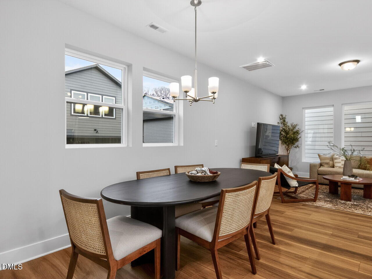 13 Tallgrass Road Pittsboro, NC 27312 - Photo 6 of 34 a view of a dining room with furniture and wooden floor