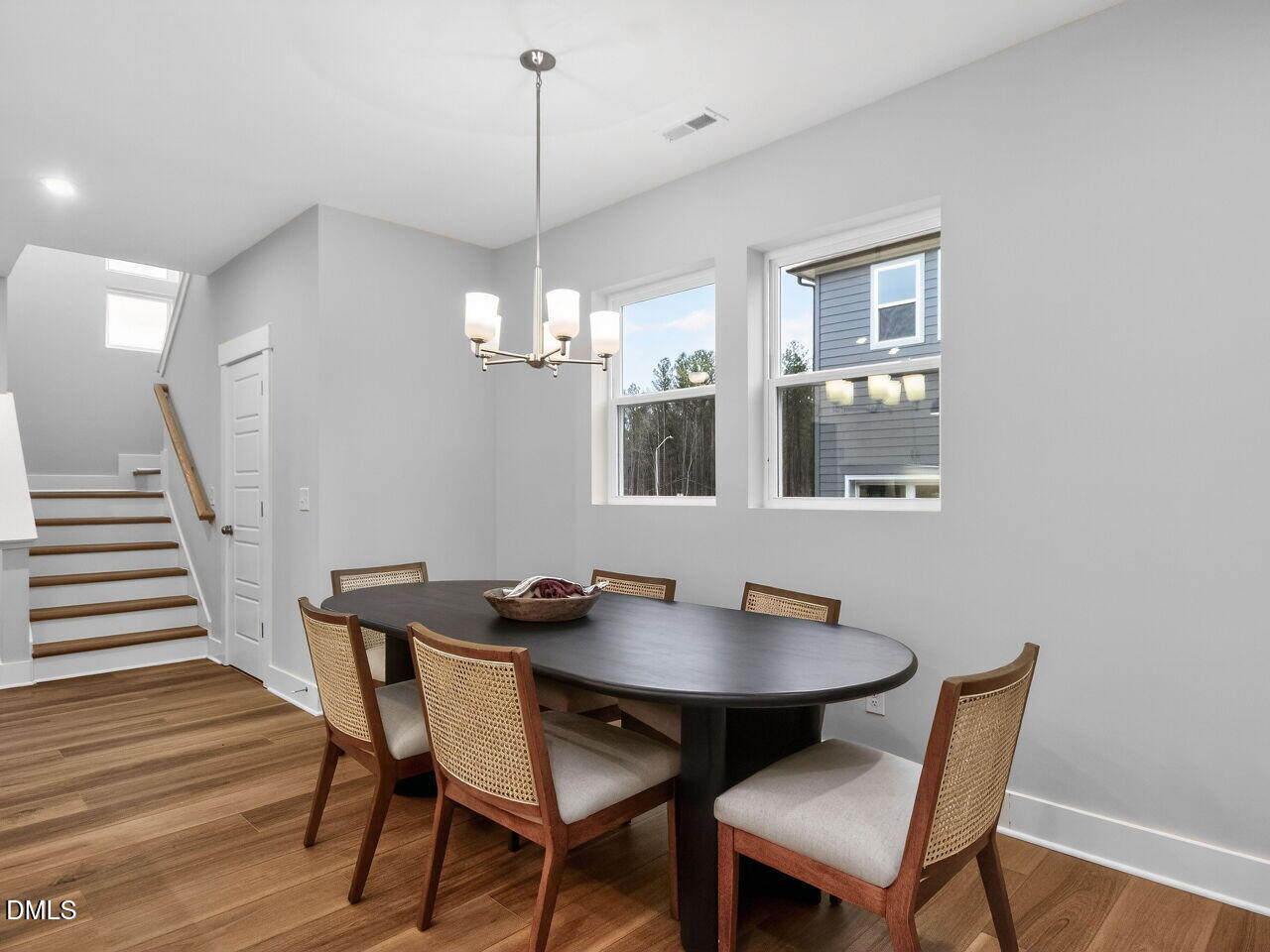 13 Tallgrass Road Pittsboro, NC 27312 - Photo 7 of 34 a view of a dining room with a table and chairs