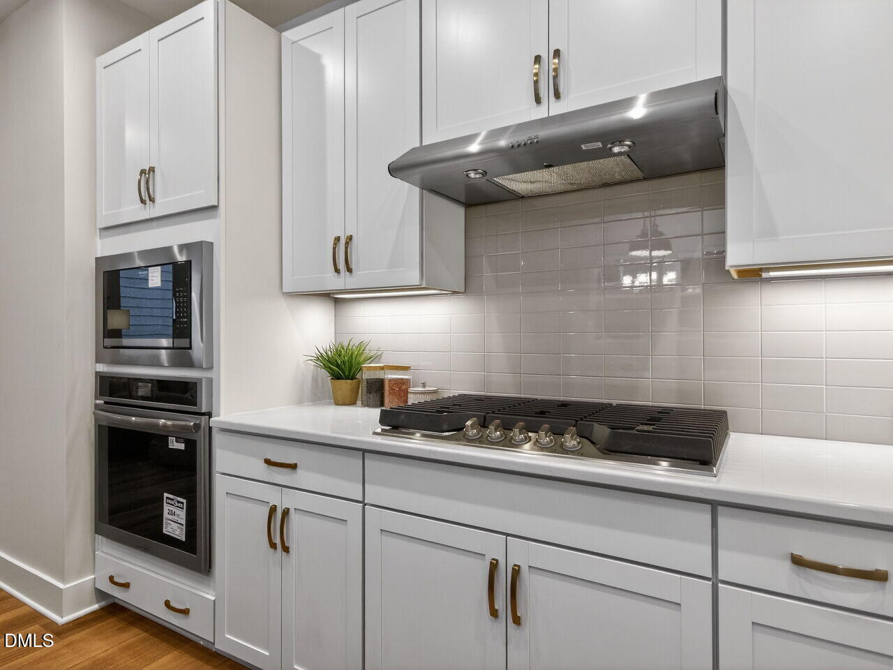 13 Tallgrass Road Pittsboro, NC 27312 - Photo 9 of 34 a kitchen with stainless steel appliances granite countertop white cabinets and a stove