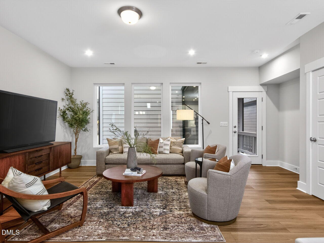 13 Tallgrass Road Pittsboro, NC 27312 - Photo 10 of 34 a living room with furniture and a flat screen tv