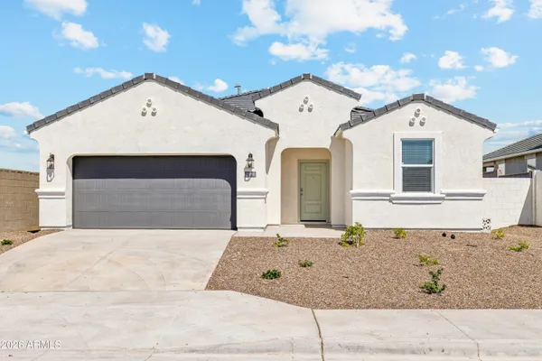 a front view of a house with garage