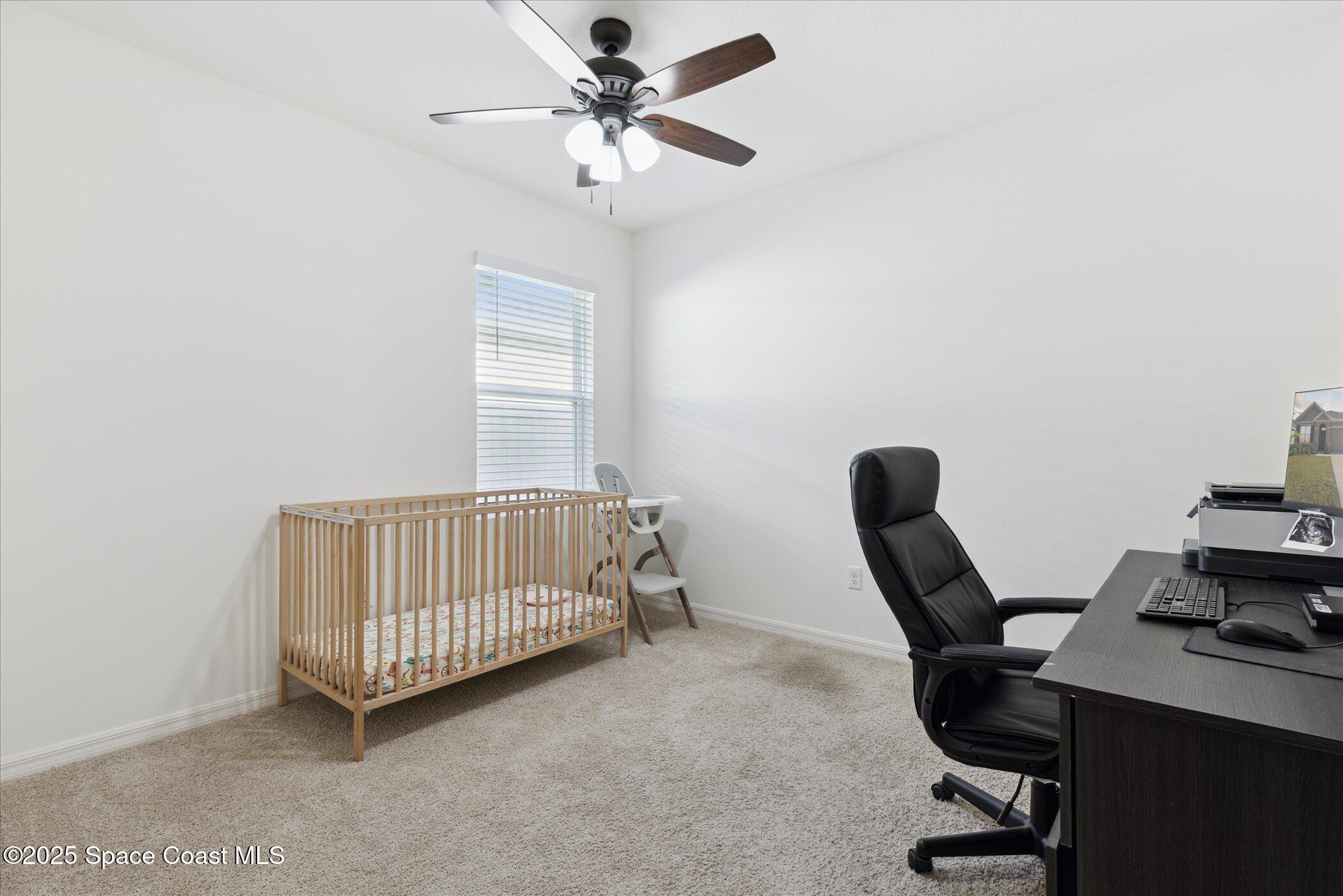 967 Trinity Street Rockledge, FL 32955 - Photo 26 of 40 a bedroom with a workspace