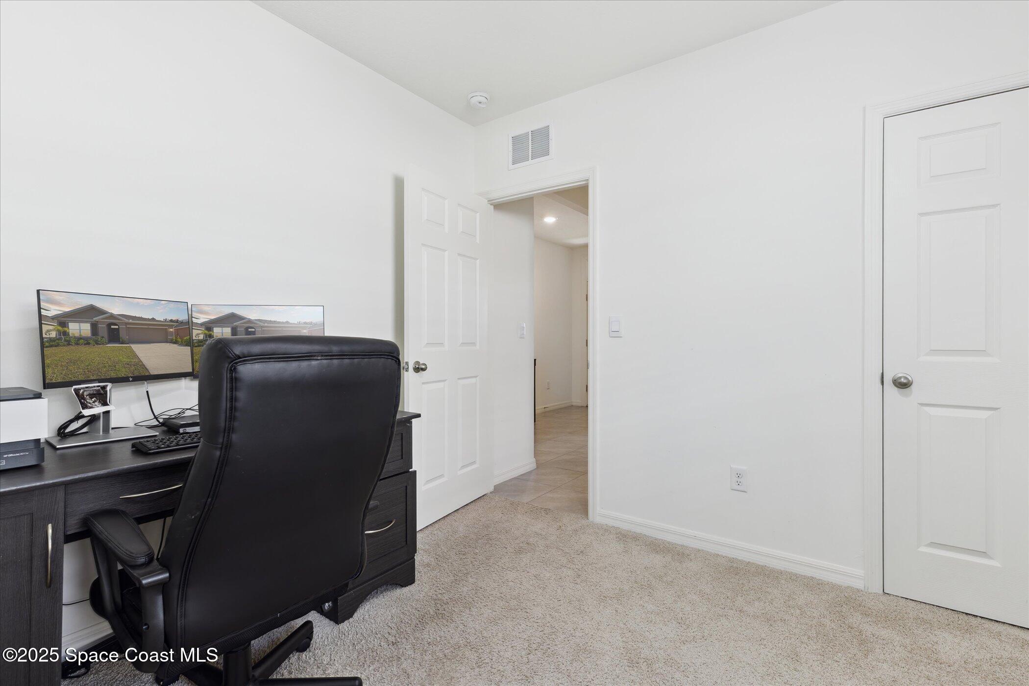 967 Trinity Street Rockledge, FL 32955 - Photo 27 of 40 a view of workspace with refrigerator
