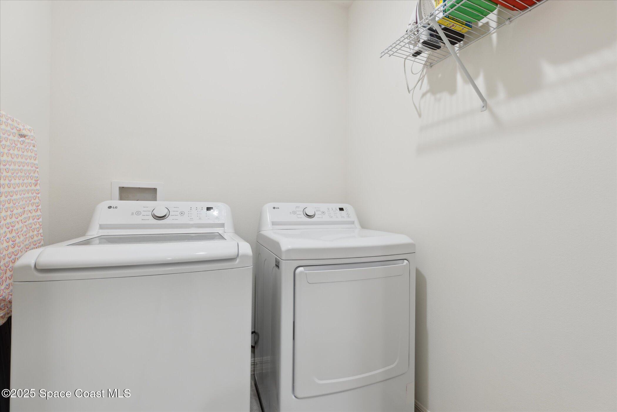 967 Trinity Street Rockledge, FL 32955 - Photo 31 of 40 a utility room with dryer and washer