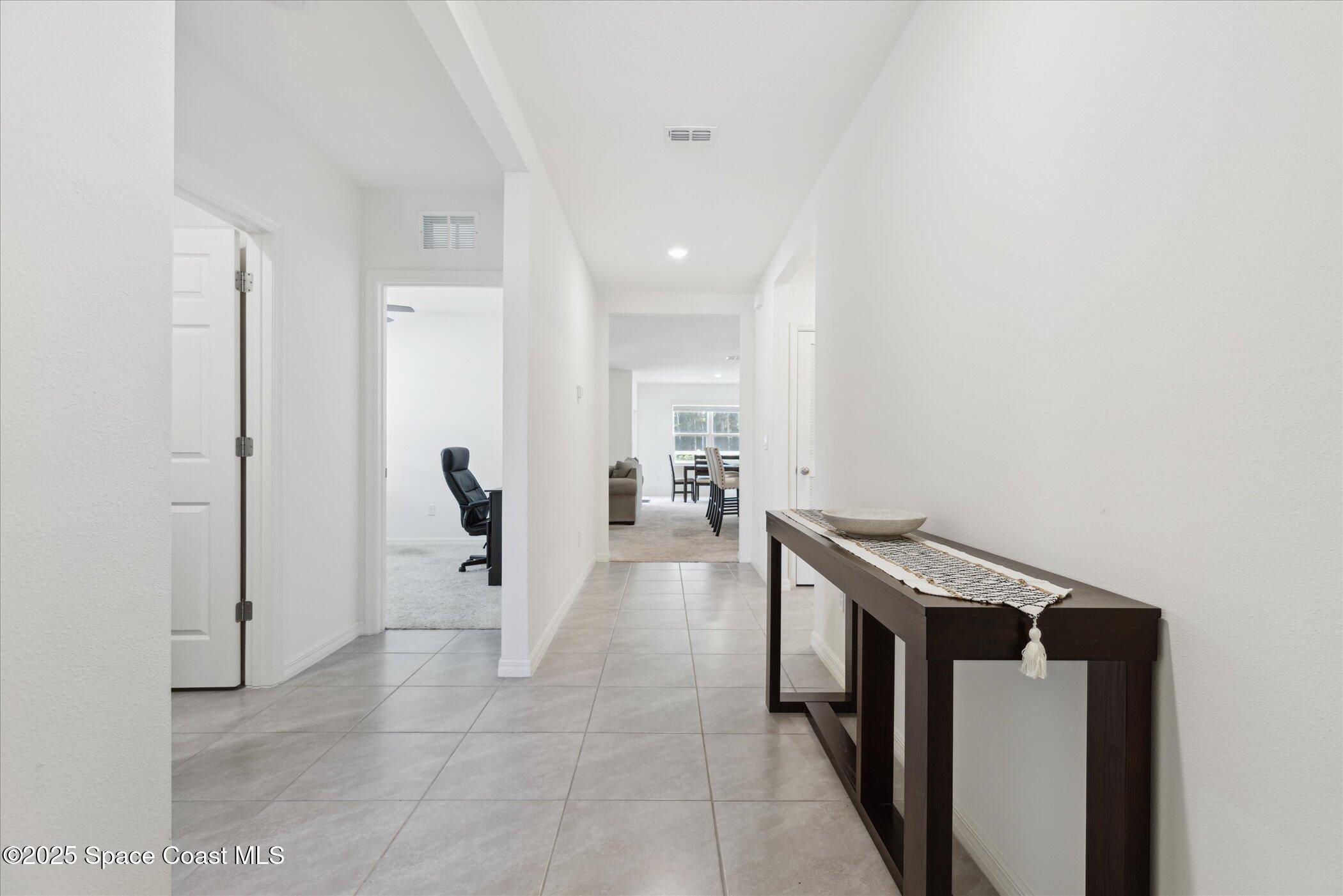 967 Trinity Street Rockledge, FL 32955 - Photo 7 of 40 a view of a hallway with seating area