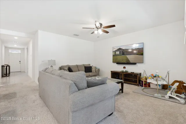 a spacious bathroom with a granite countertop sink and a mirror