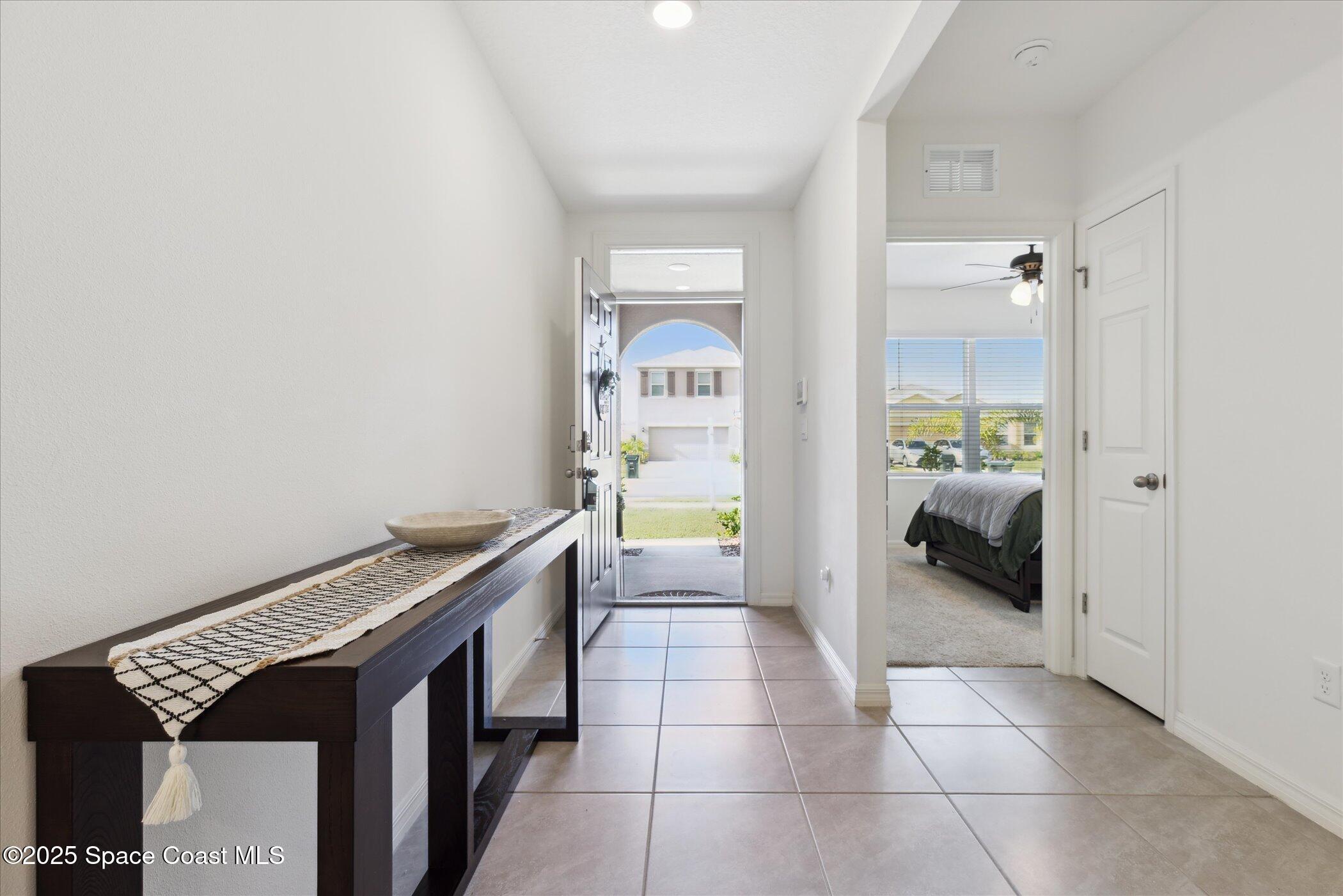 967 Trinity Street Rockledge, FL 32955 - Photo 9 of 40 a spacious bathroom with a granite countertop sink and a mirror