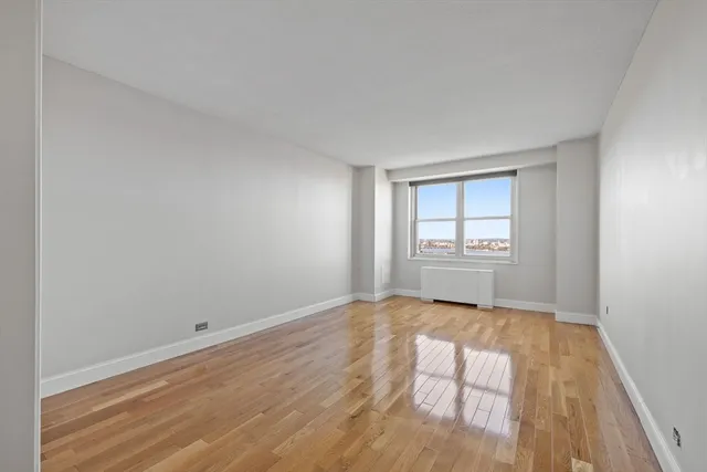 a view of an empty room and a window