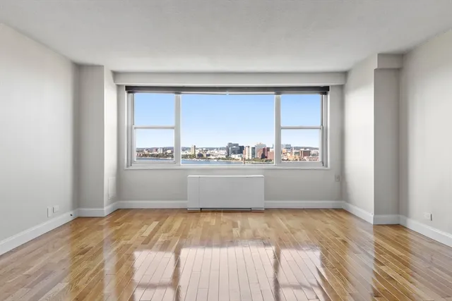 a view of lot of kitchen with natural light