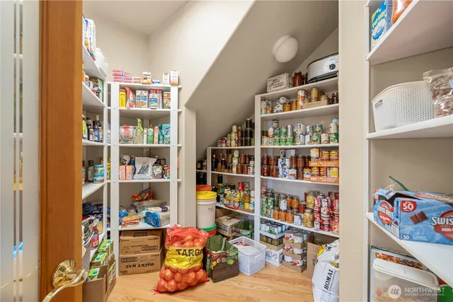 a room with book shelf and a window