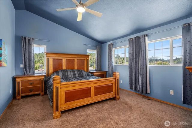 a bed room with a bed and a window