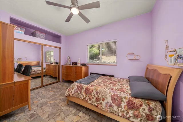 a bedroom with a bed and furniture