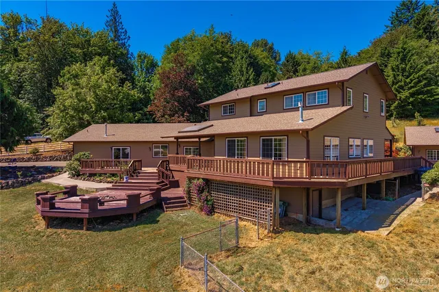 aerial view of a house with swimming pool and sitting area
