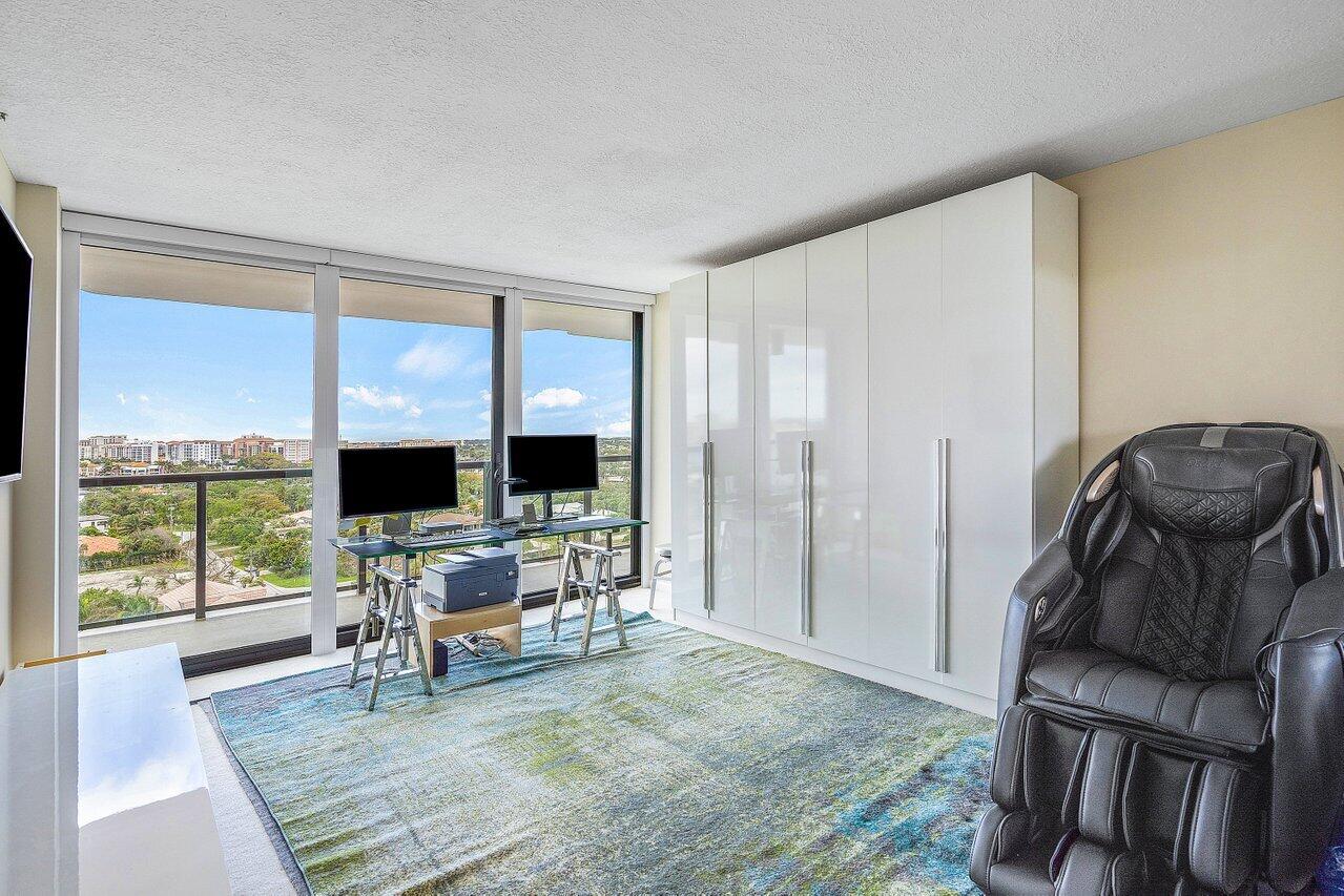 250 South Ocean Boulevard, Unit 10C Boca Raton, FL 33432 - Photo 13 of 33 a living room with furniture and a flat screen tv