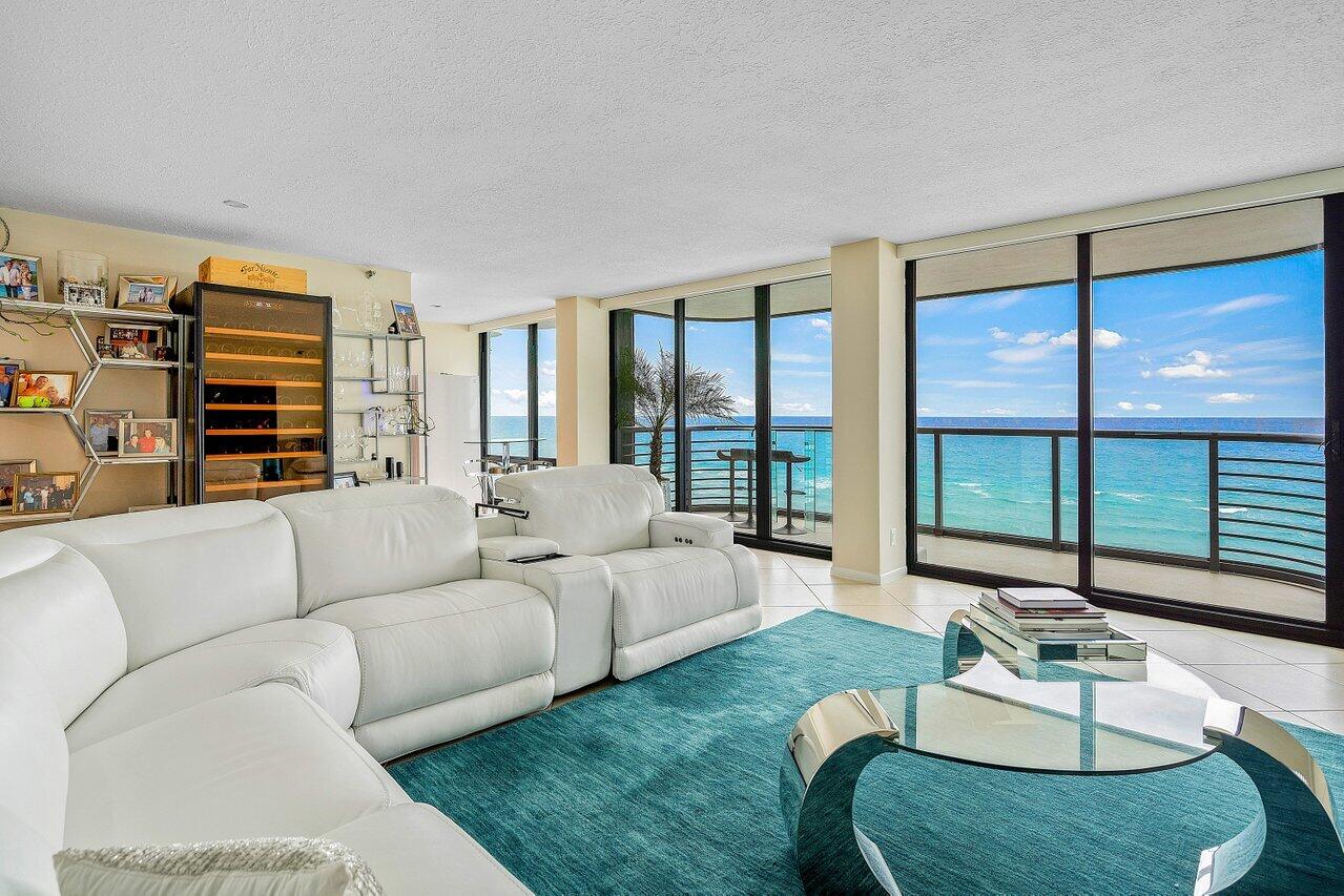 250 South Ocean Boulevard, Unit 10C Boca Raton, FL 33432 - Photo 2 of 33 a living room with furniture and a large window
