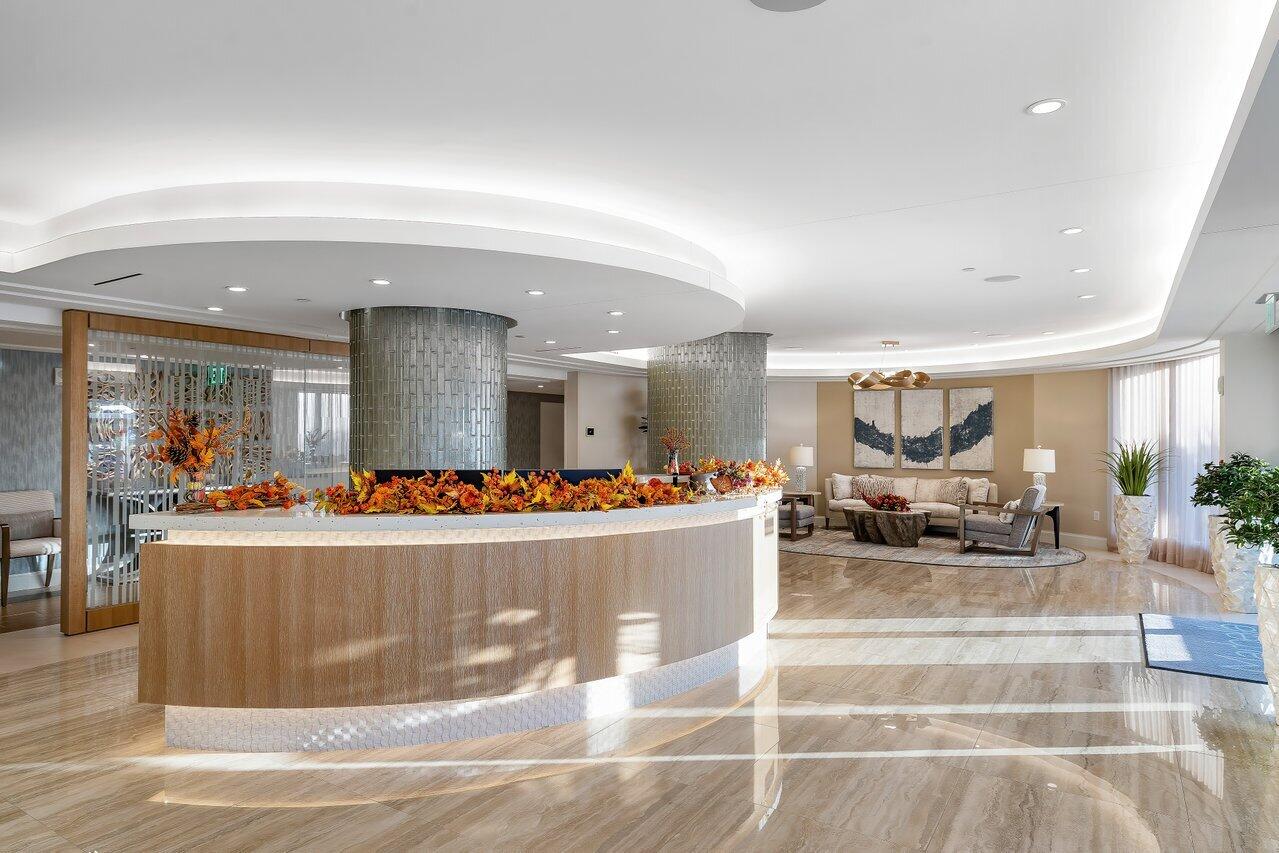 250 South Ocean Boulevard, Unit 10C Boca Raton, FL 33432 - Photo 27 of 33 a view of a living room and a chandelier