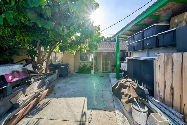 a view of a backyard with furniture