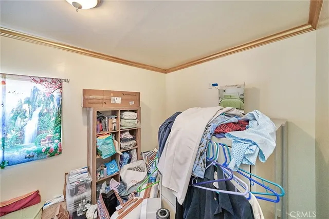a bed room with a bed and a book shelf