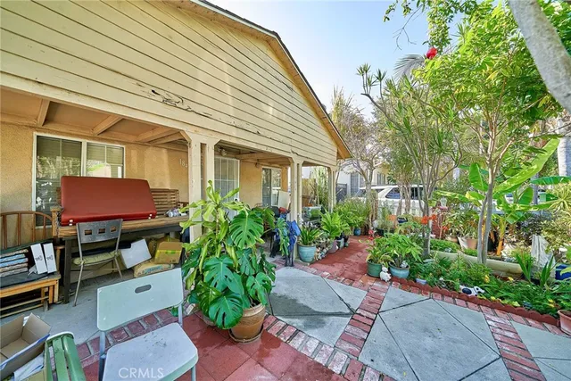 a front view of house with yard and outdoor seating
