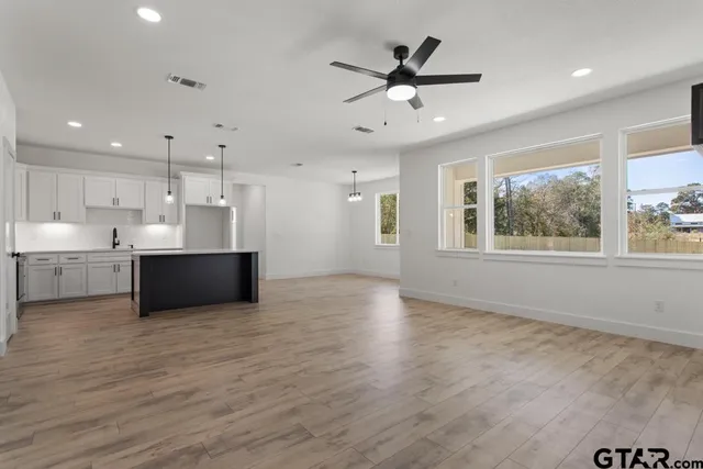 a view of kitchen with wooden floor and window