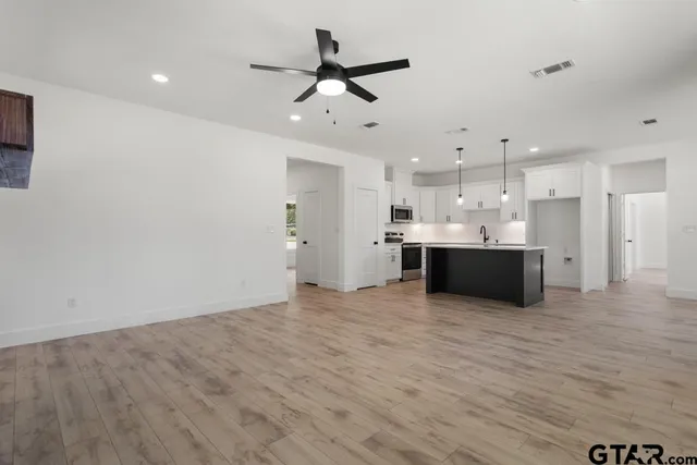 a view of kitchen with wooden floor