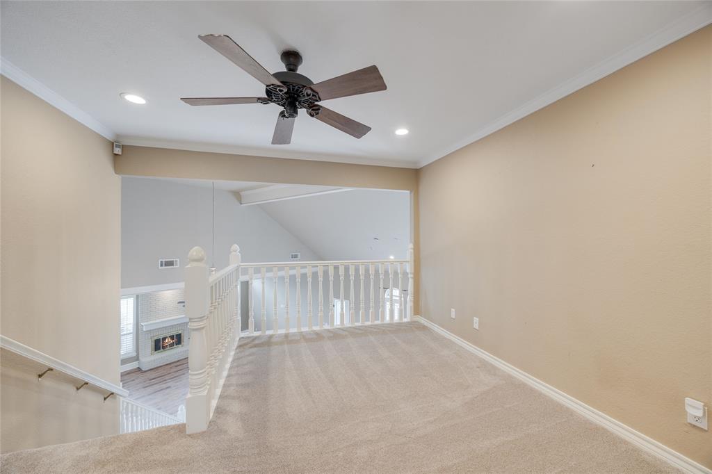 1201 Findlay Drive Arlington, TX 76012 - Photo 31 of 35 a view of a hallway with a ceiling fan