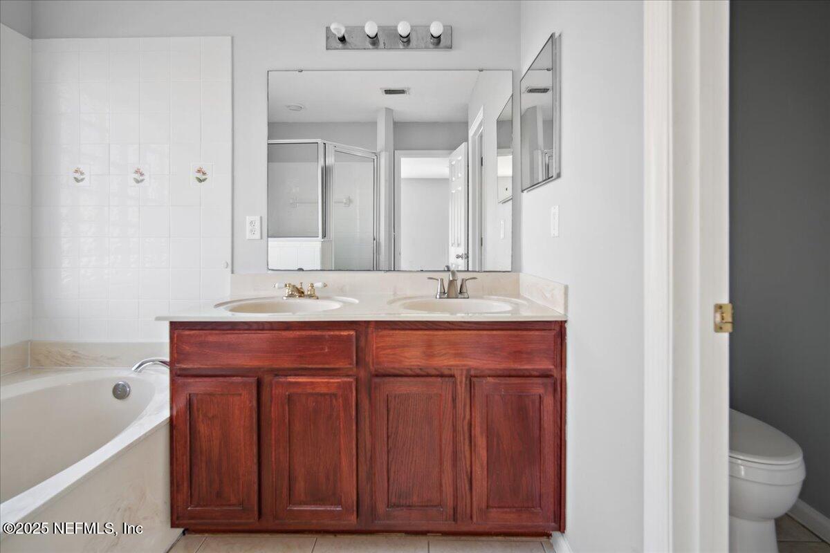 1672 Avenger Lane Jacksonville, FL 32221 - Photo 27 of 48 a bathroom with a sink and a bathtub