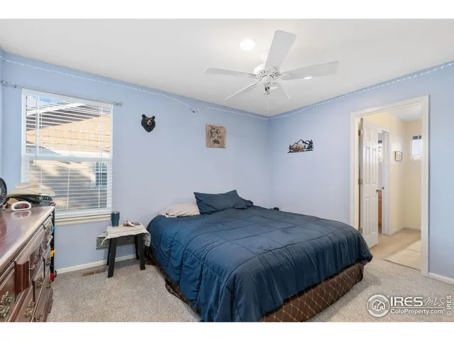 a bedroom with a bed and a table