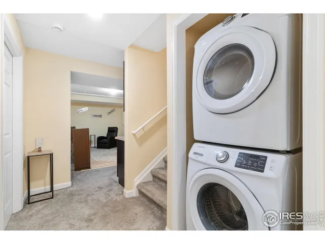 a view of a hallway with washer and dryer