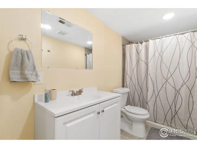 a bathroom with a sink toilet and vanity