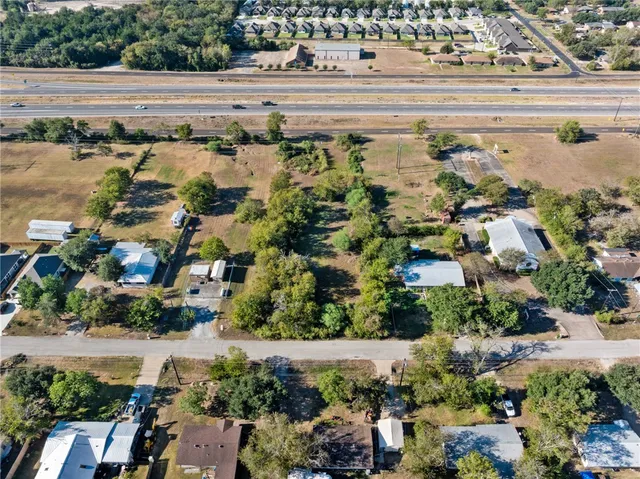 an aerial view of a building with outdoor space