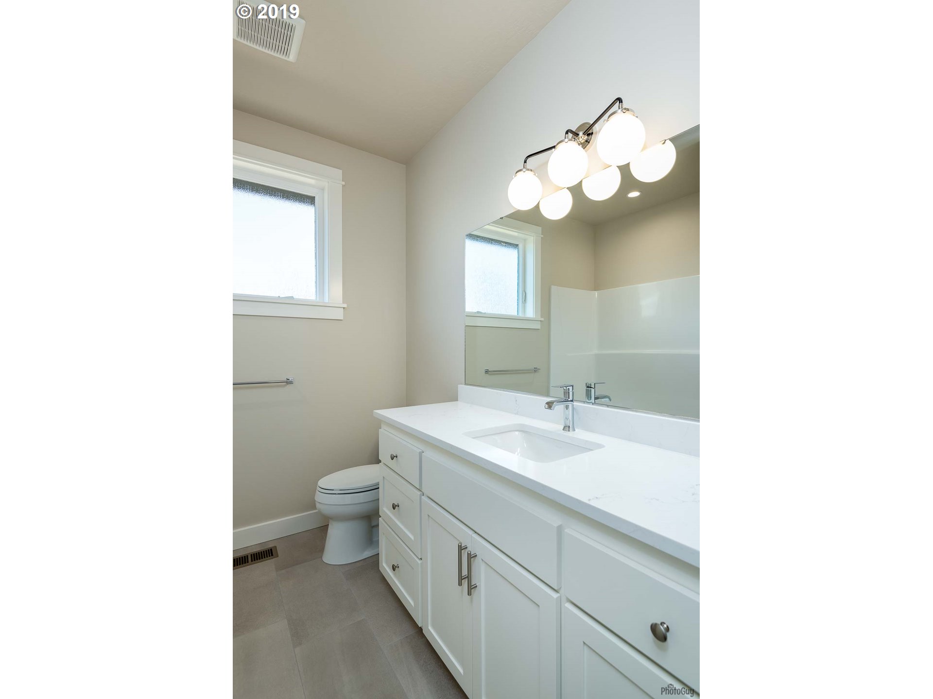 993 South 66th Court Springfield, OR 97478 - Photo 22 of 32 a bathroom with a sink and a mirror