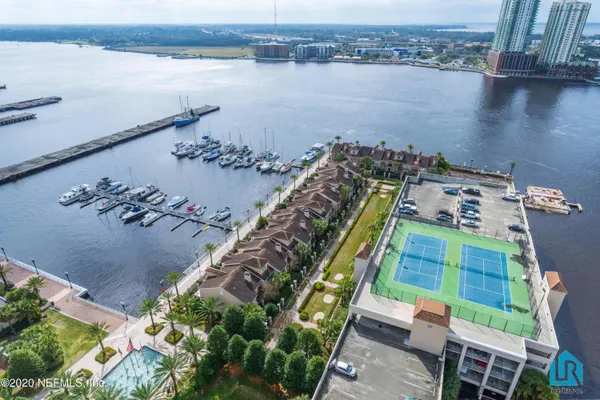 a view of a dining room with furniture wooden floor and chandelier