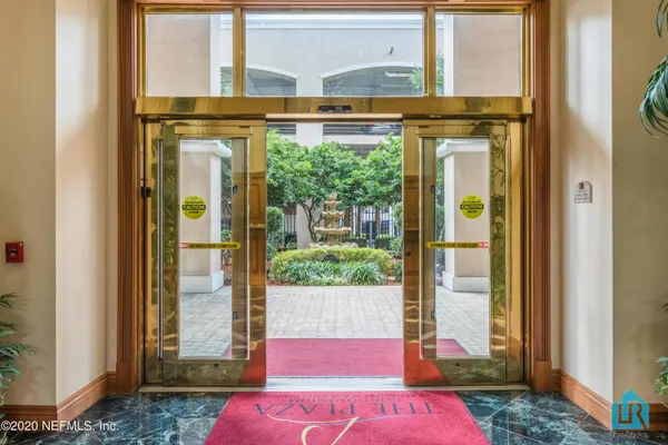 a view of a bathroom with a sink and a window