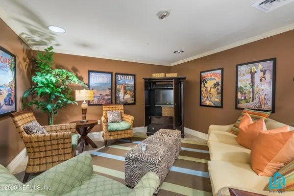 a view of a lake with boats and trees in the background