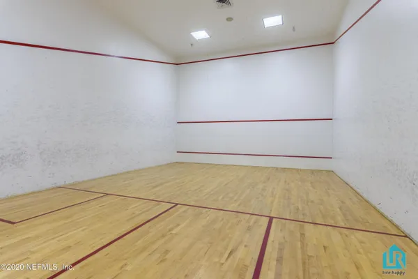 a view of multi story residential apartment building with a garden and plants