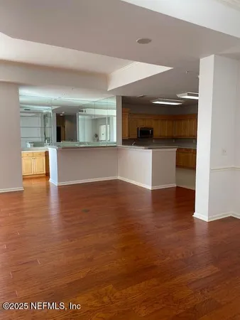 a kitchen with stainless steel appliances granite countertop a refrigerator and a stove