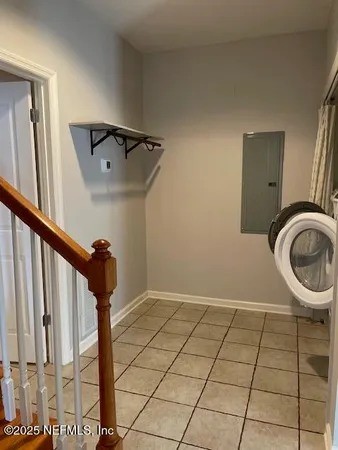 a bathroom with a glass shower door