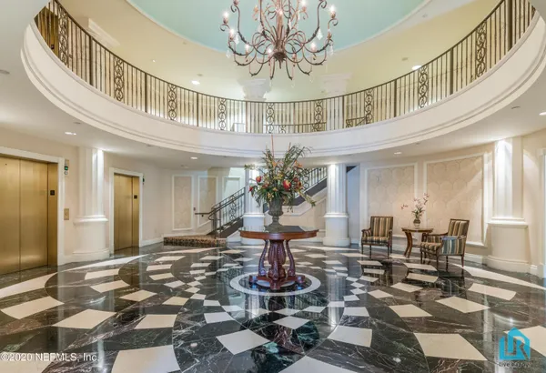 a view of a balcony with wooden floor