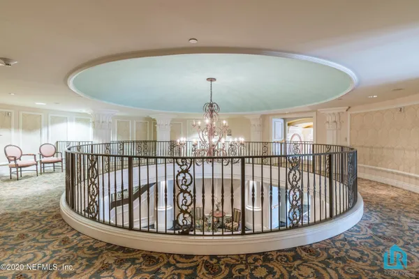 a view of balcony with wooden floor and fence