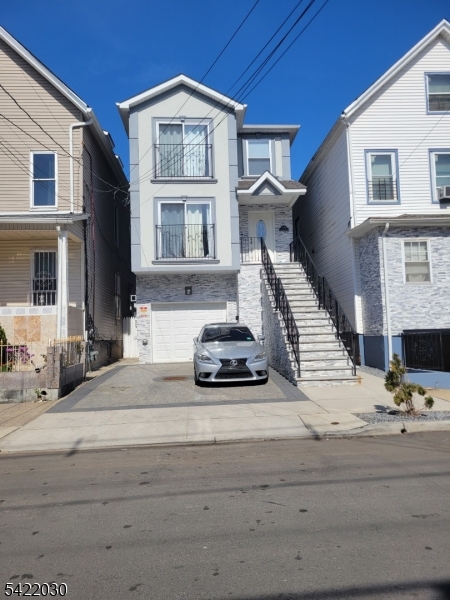 519 Franklin Street Elizabeth Port, NJ 07206 - Photo 1 of 1 a view of a brick house with many windows