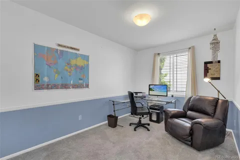 a workspace with furniture and window