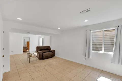 a living room with furniture and window