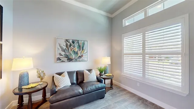 a living room with furniture and a large window